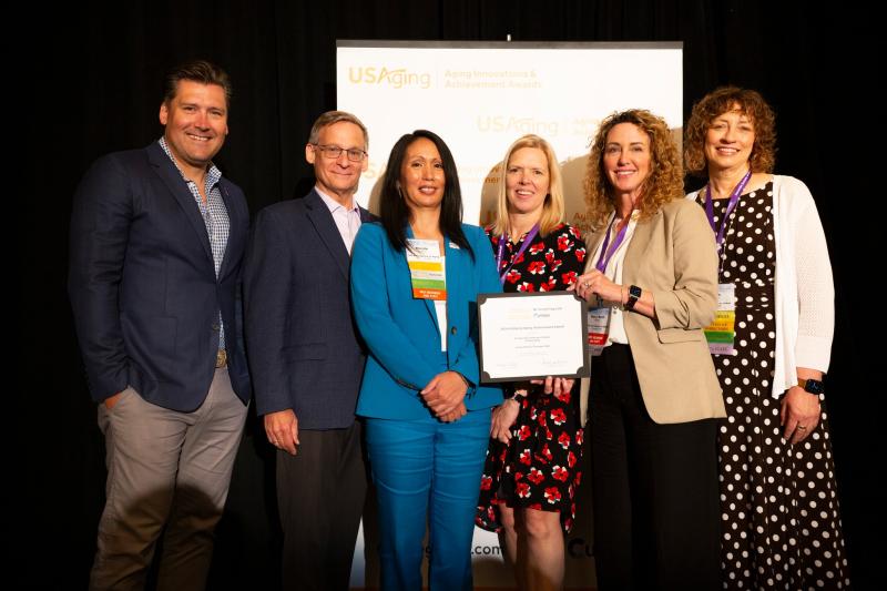 LMTAAA staff and others accepting an award.