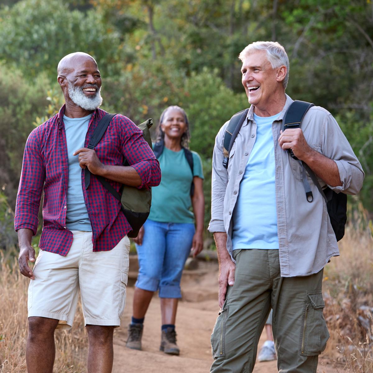 Group of four older adults on a nature hike 